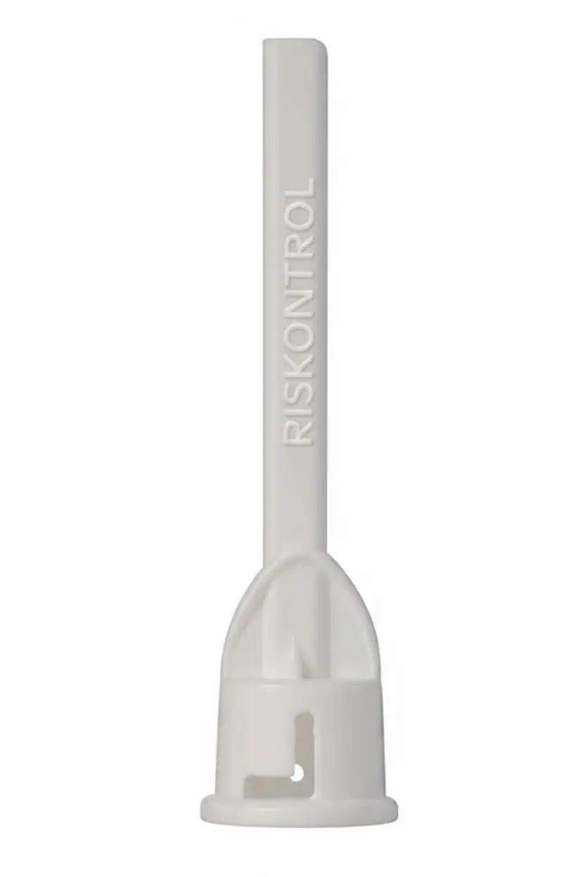 Close-up of Acteon RISKONTROL White Mint disposable air water syringe tip showing flexible dual channel design