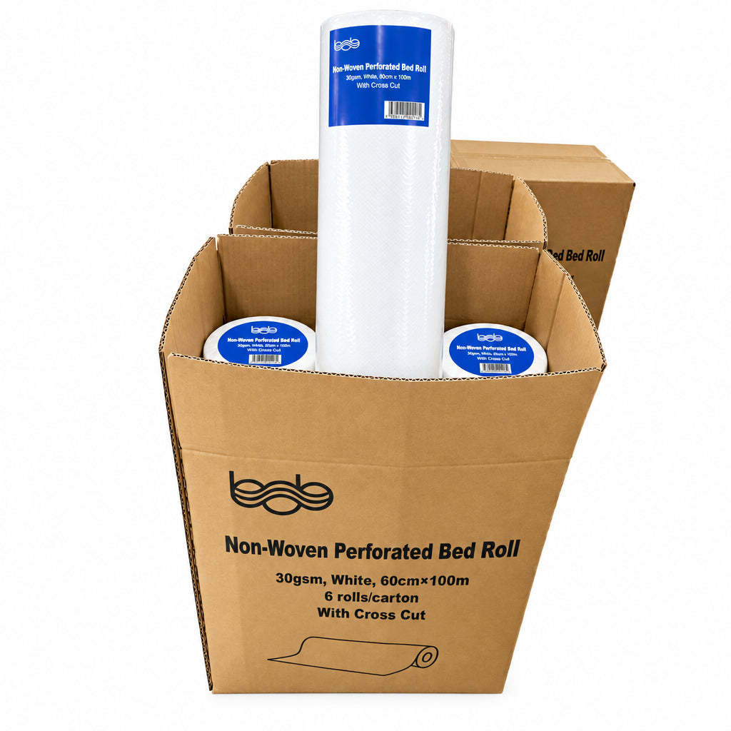 Carton of 6 disposable non-woven perforated bed rolls, 60cm x 100m