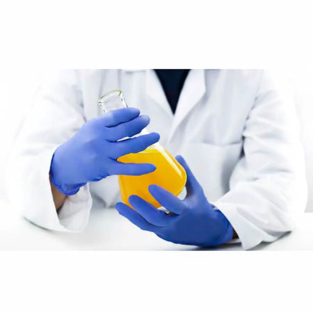 Kensington 1975® powder-free nitrile examination gloves in ice blue worn by healthcare professional in Perth WA clinic