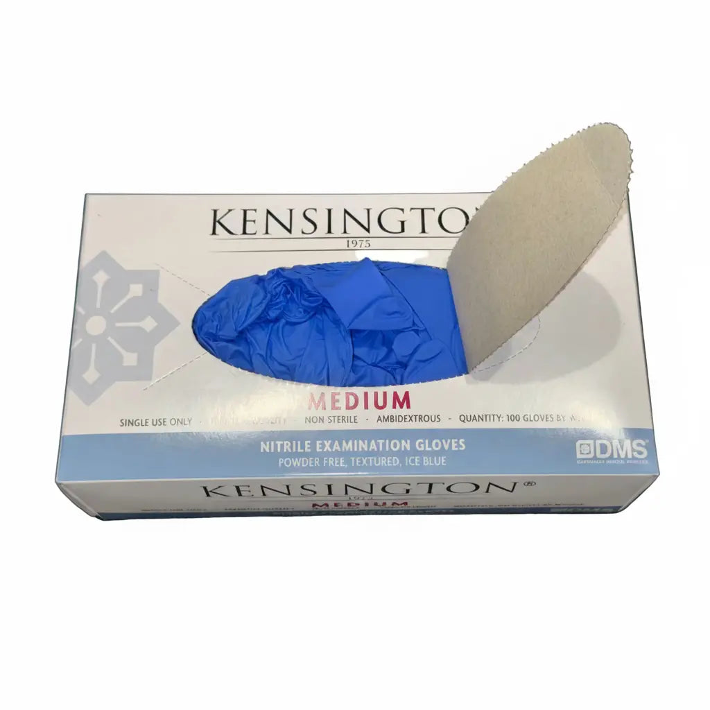 Medical professional wearing Kensington 1975® nitrile examination gloves with branded box visible in clinical setting