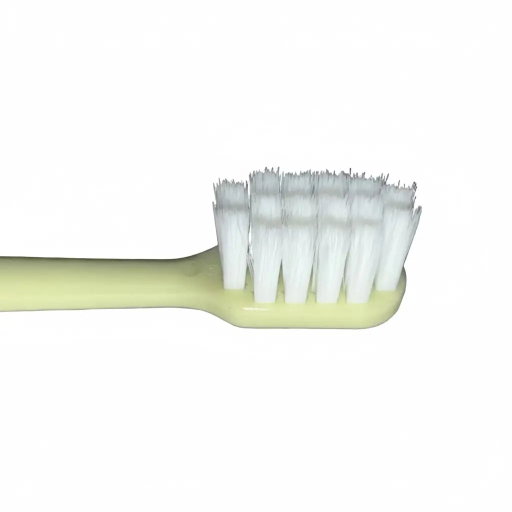 Close-up of the ultra-soft PBT bristles on a Kids Ultra Soft Toothbrush, showing the fine 0.12 mm filaments designed for comfortable daily brushing.