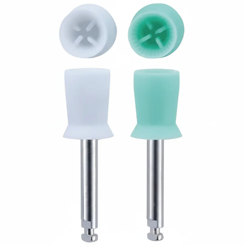 Close-up detail of white and soft green latch-type prophy cups showing flexible web design and high torque gear for dental polishing