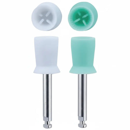 Close-up detail of white and soft green latch-type prophy cups showing flexible web design and high torque gear for dental polishing